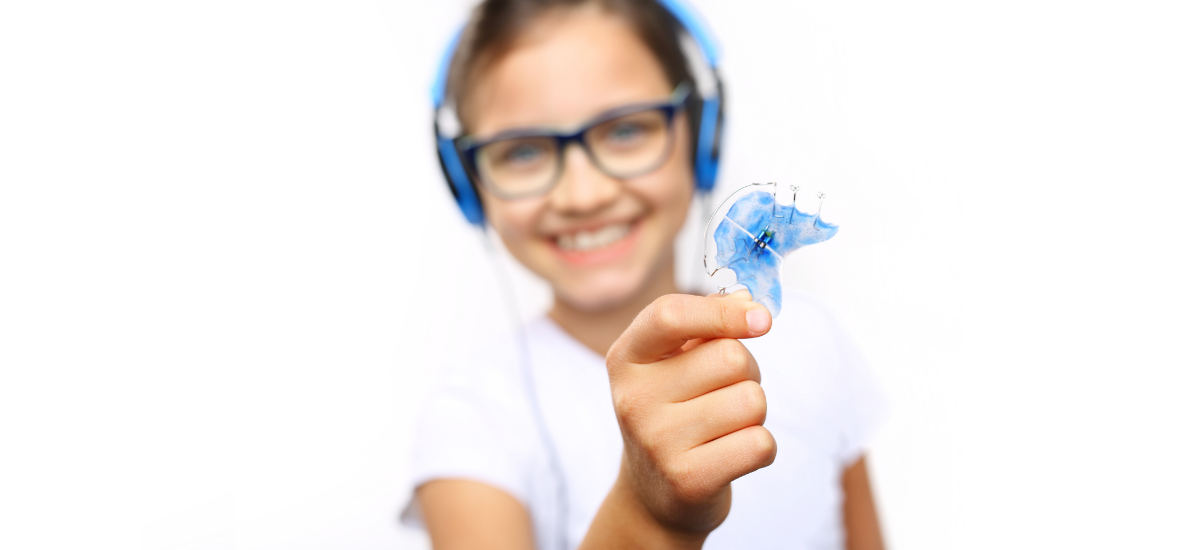 Jak aparat Twin Block wpływa na pionowe proporcje twarzy u pacjentów w okresie wzrostu?